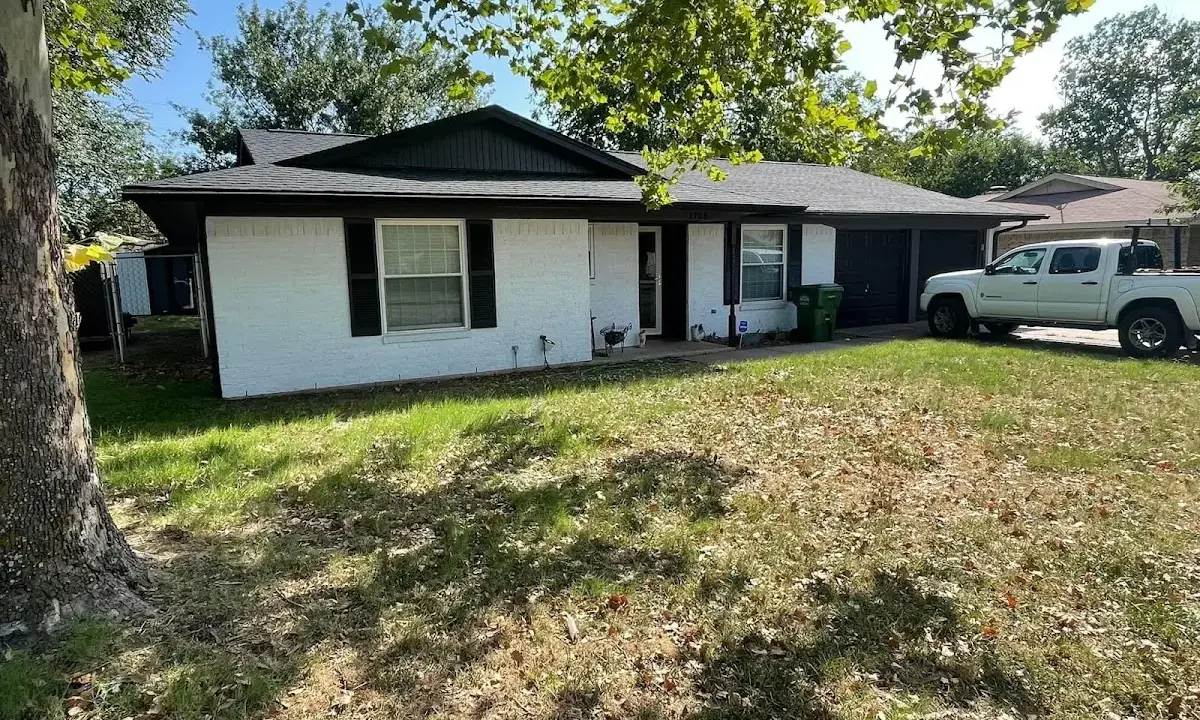 Professional roofing crew working on a residential roof in Waunakee